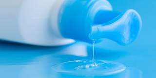 Bottle of lubricant dripping