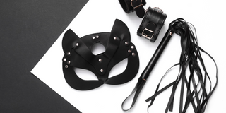 Fetish mask handcuffs and flogger 
